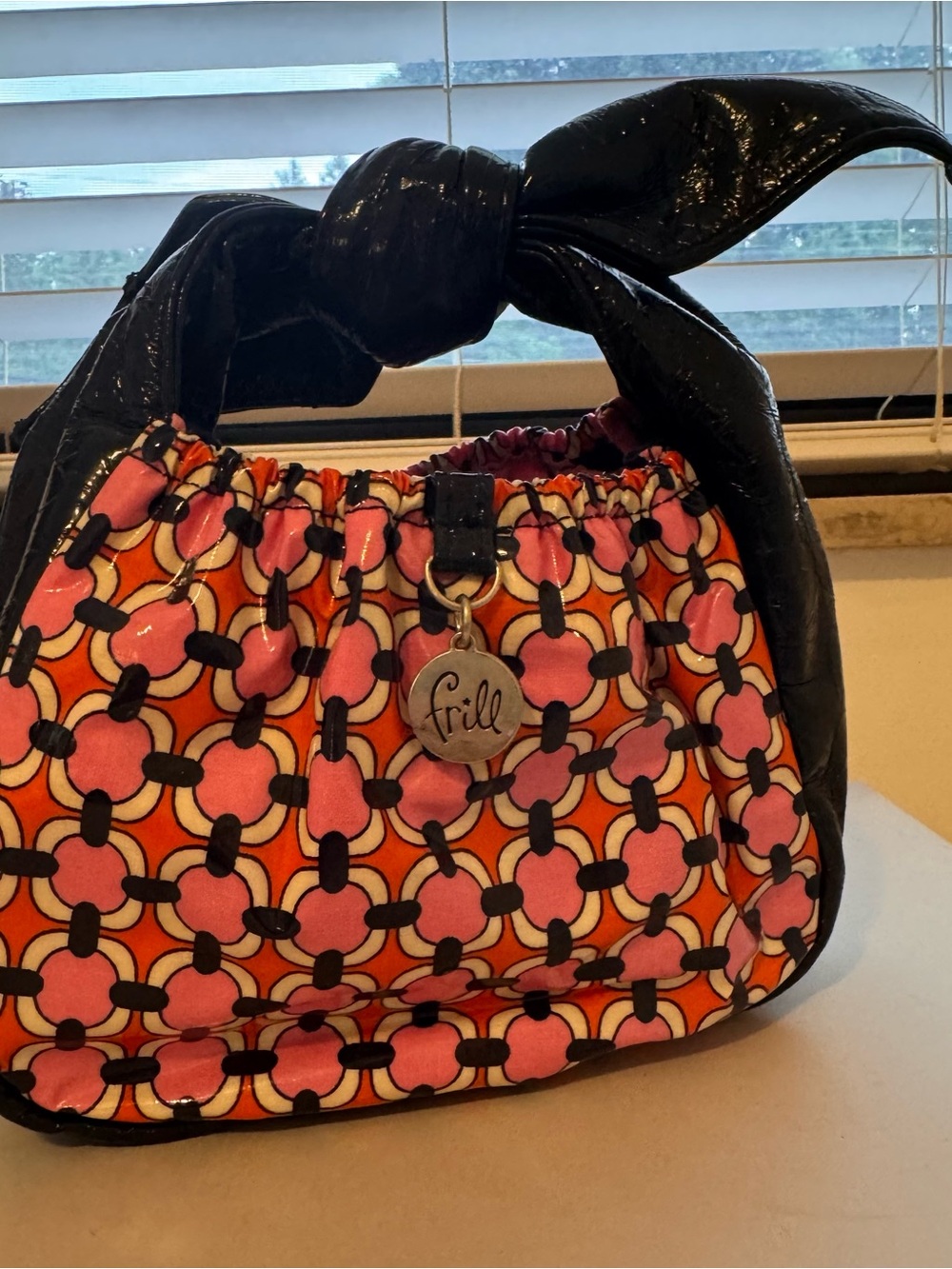Vera Bradley Pink and Orange Patterned mini Bag with Navy Blue Glossy Handle